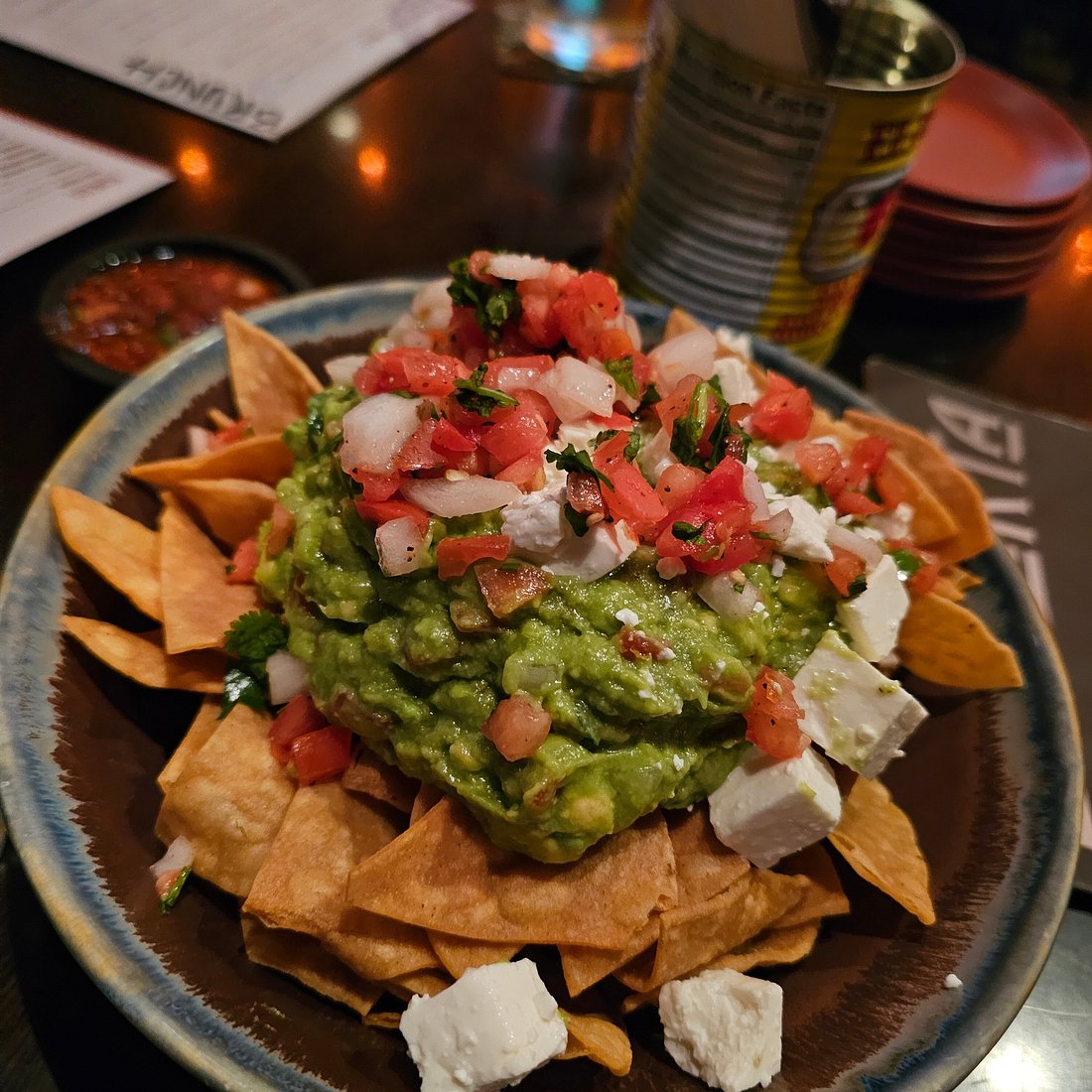 La Puerta signature dishes Chips & GuacamoleCalifornia BurritoCochinita Tostaditas